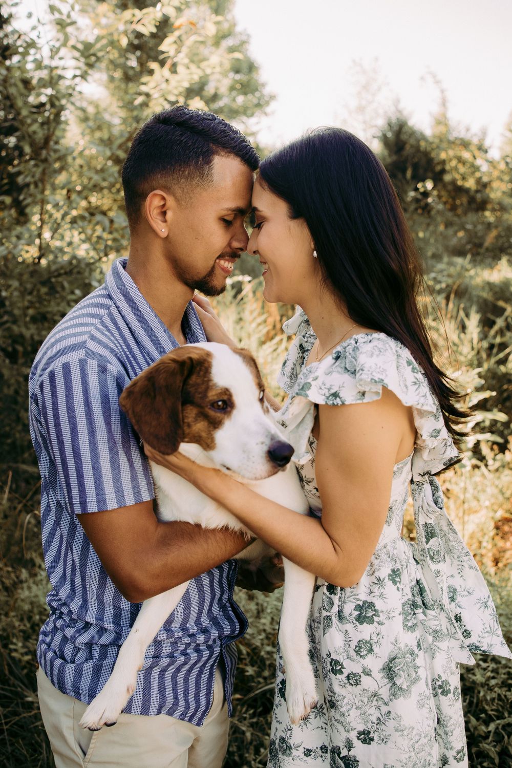 Outdoor engagement couple portrait in Manassas battlefield with puppy
