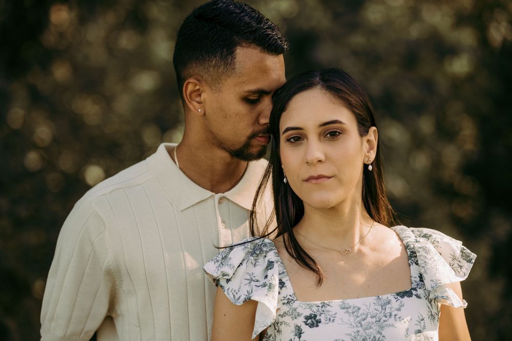 Outdoor engagement couple portrait in Manassas battlefield at golden hour