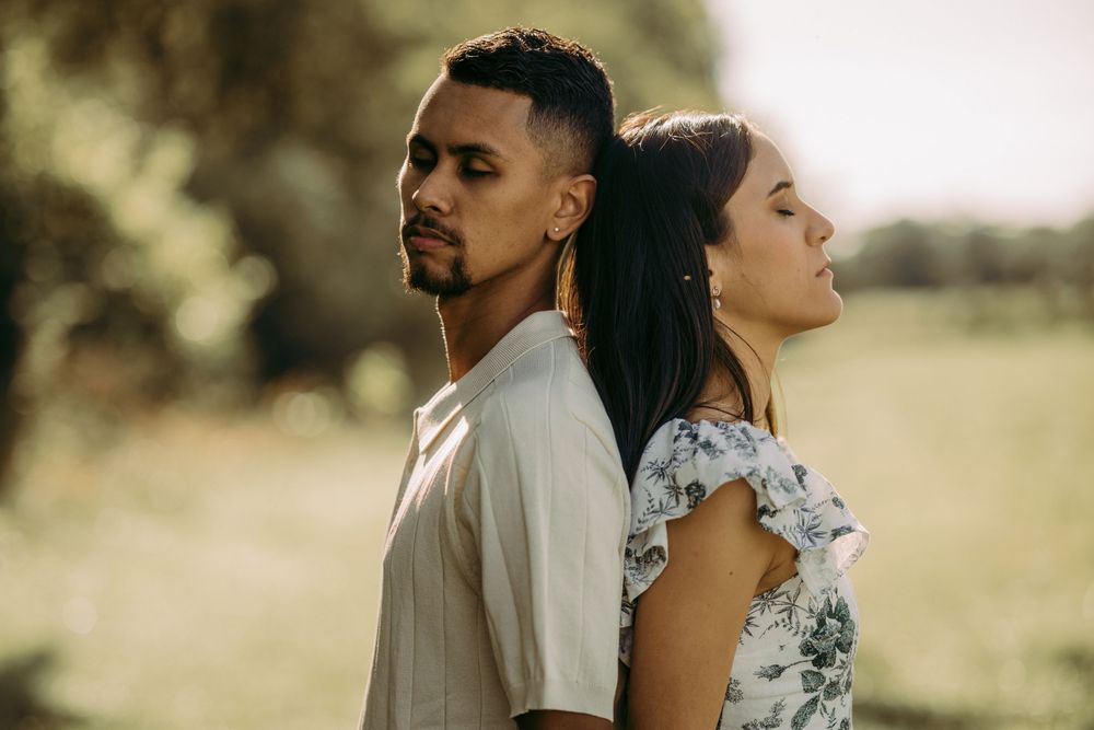 Outdoor engagement couple portrait in Manassas battlefield at golden hour